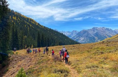 children hiking on a trail in fall