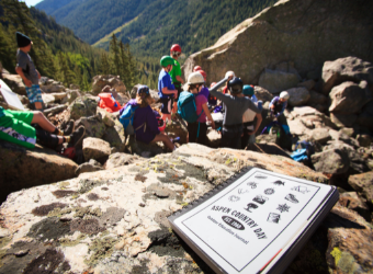 Middle School students with outdoor ed journal in foreground