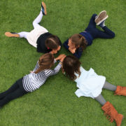 4 girls from above on turf field
