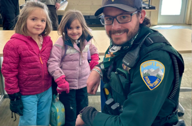 Pitkin County Sheriff's deputy Dru Lucchesi chats with some preschool children in his role as school resource officer at Aspen Country Day School
