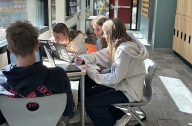 Middle School students working on their laptops in the hallway at Aspen Country Day School in Colorado